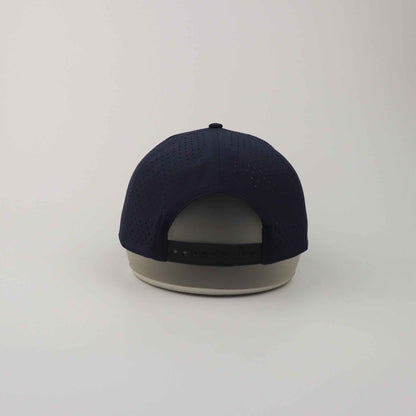 Navy Blue Golf Snapback Hat made of breathable perforated polyester with adjustable plastic snapback closure and structured crown